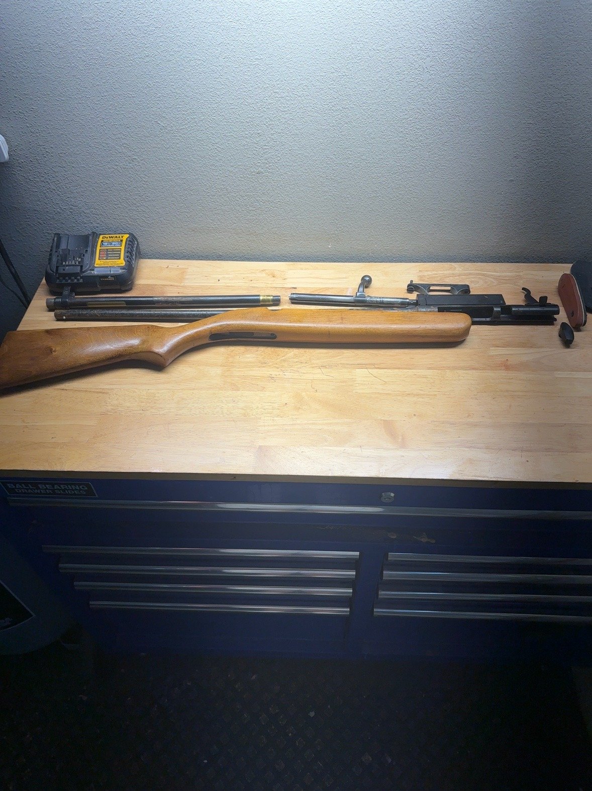 Disassembled Stevens Model 59A .410 shotgun laid out on a workbench
