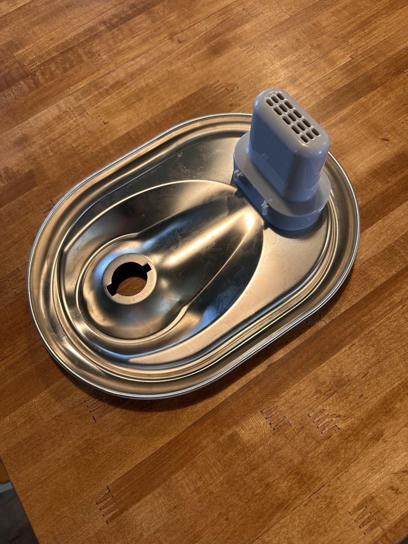 Stainless-steel drinking tray with the gray dispenser installed