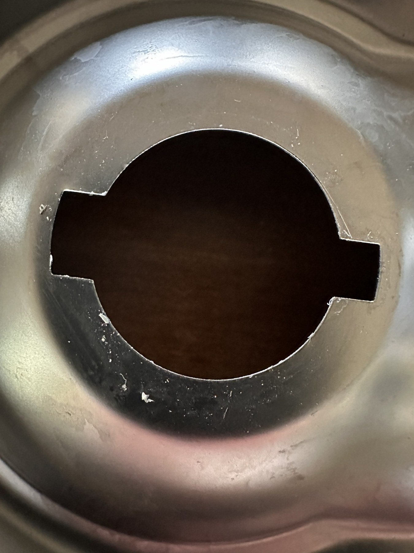 Close view of the keyed dispenser opening in the stainless tray