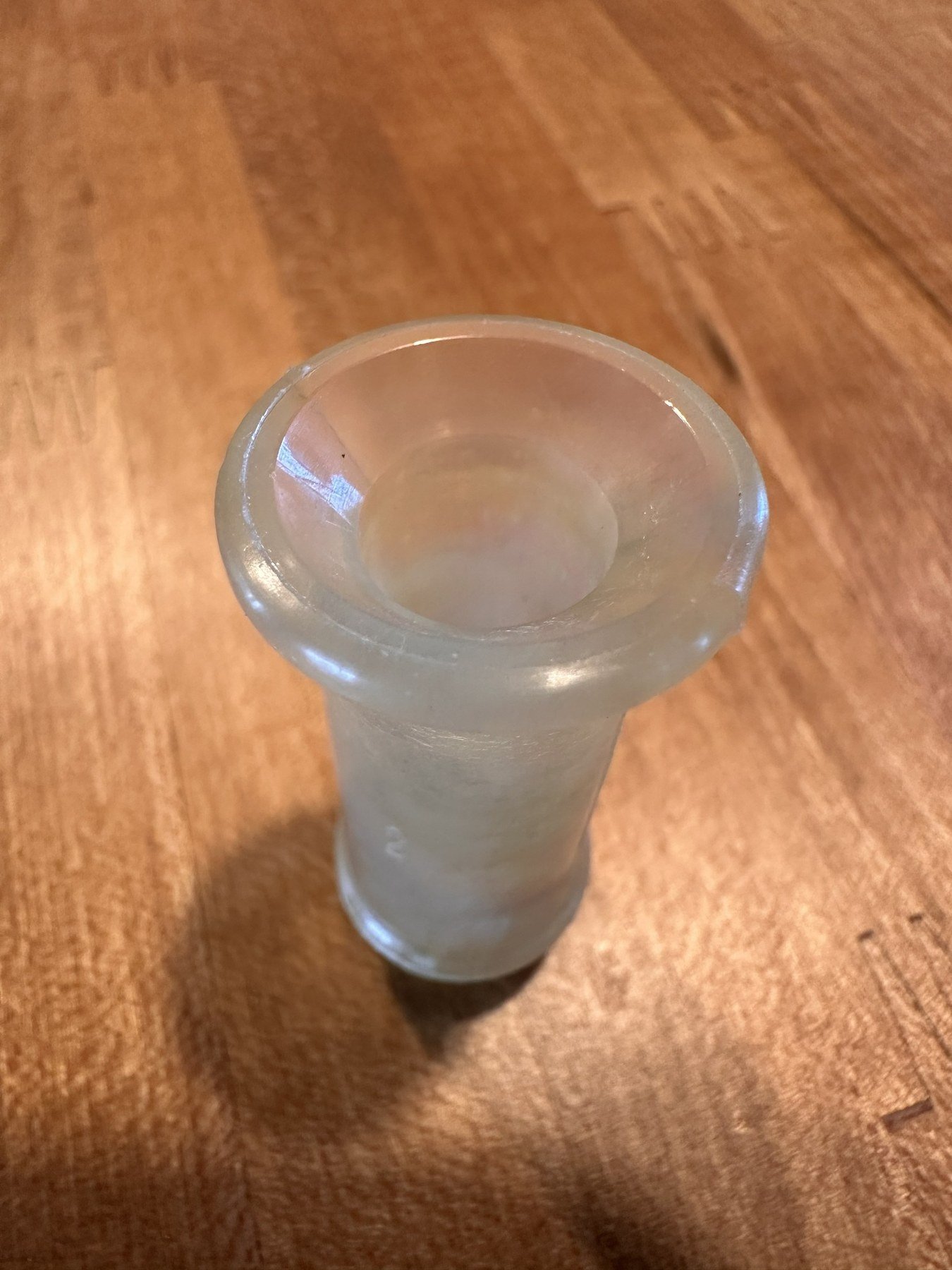 Close view of the narrow end of the translucent outlet stem