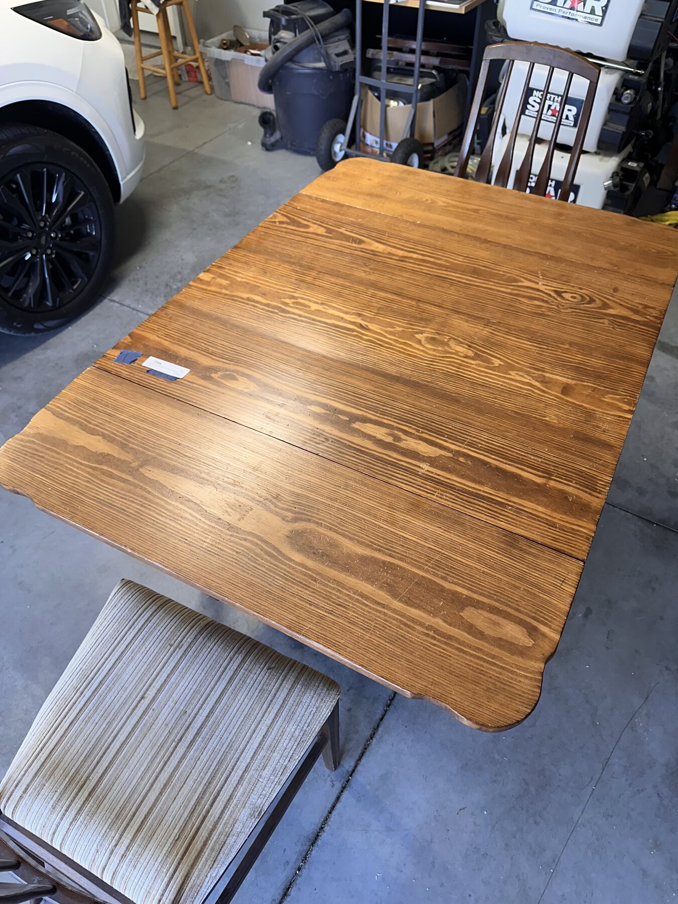 Drop-leaf table and chairs arranged in the garage after arriving home