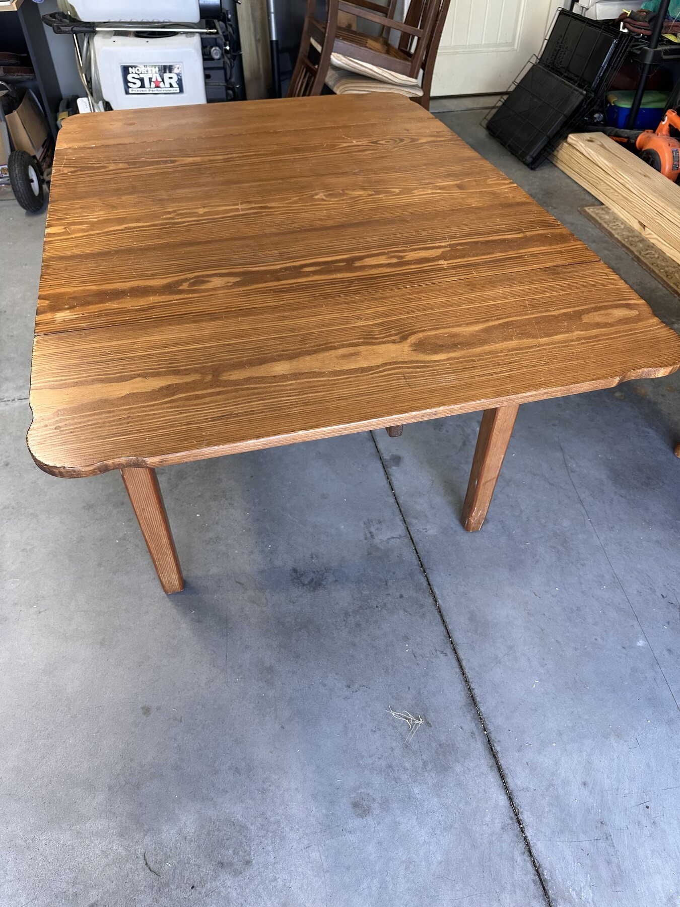 Full view of the wooden table standing in the garage