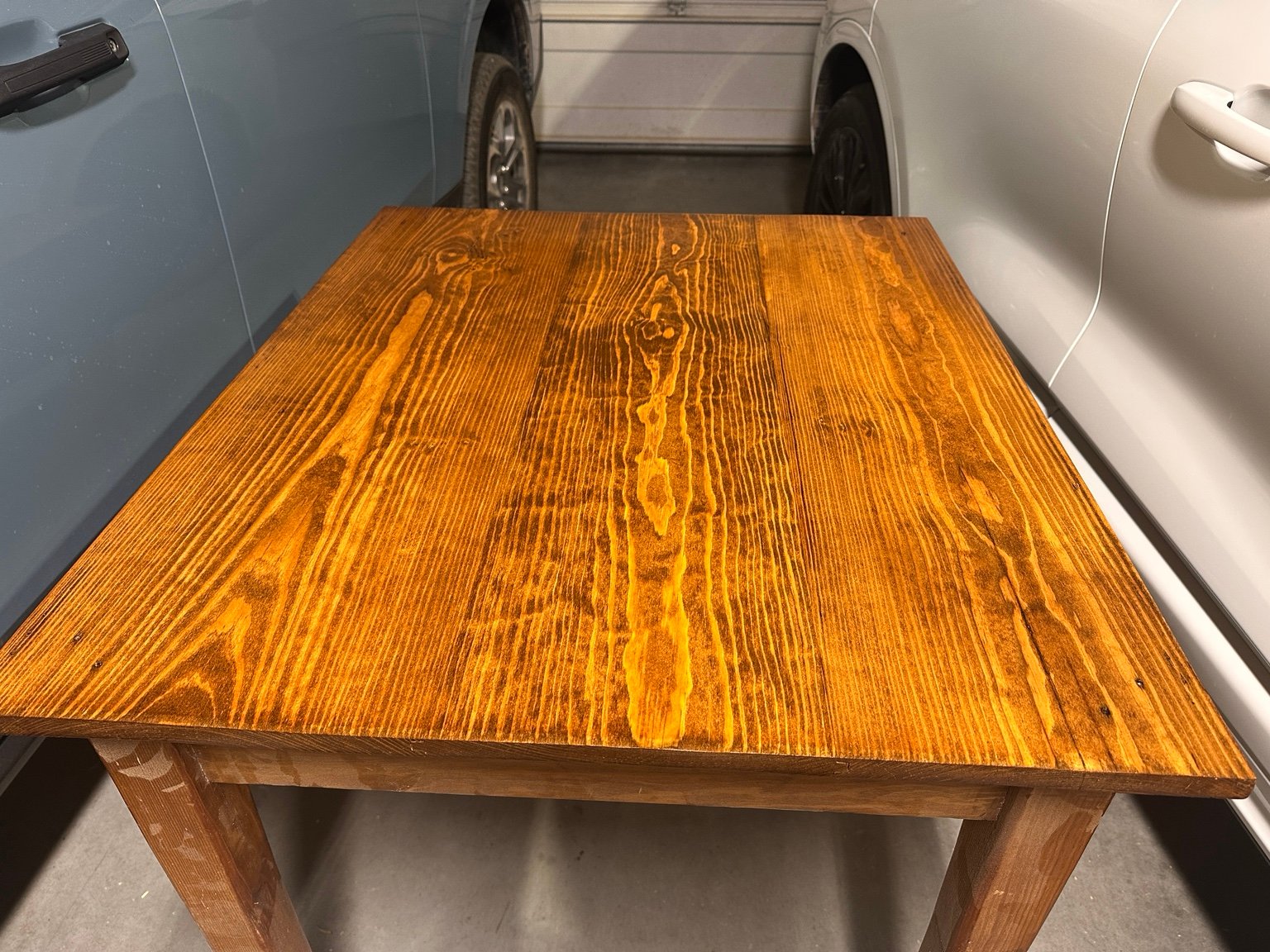 Straight front view of the center tabletop after its fifth Warm Gloss polyurethane coat