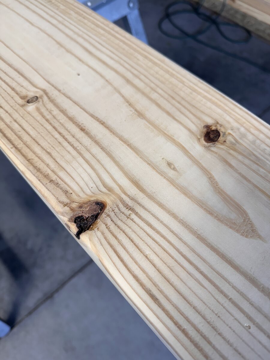 Two knots in the sanded board