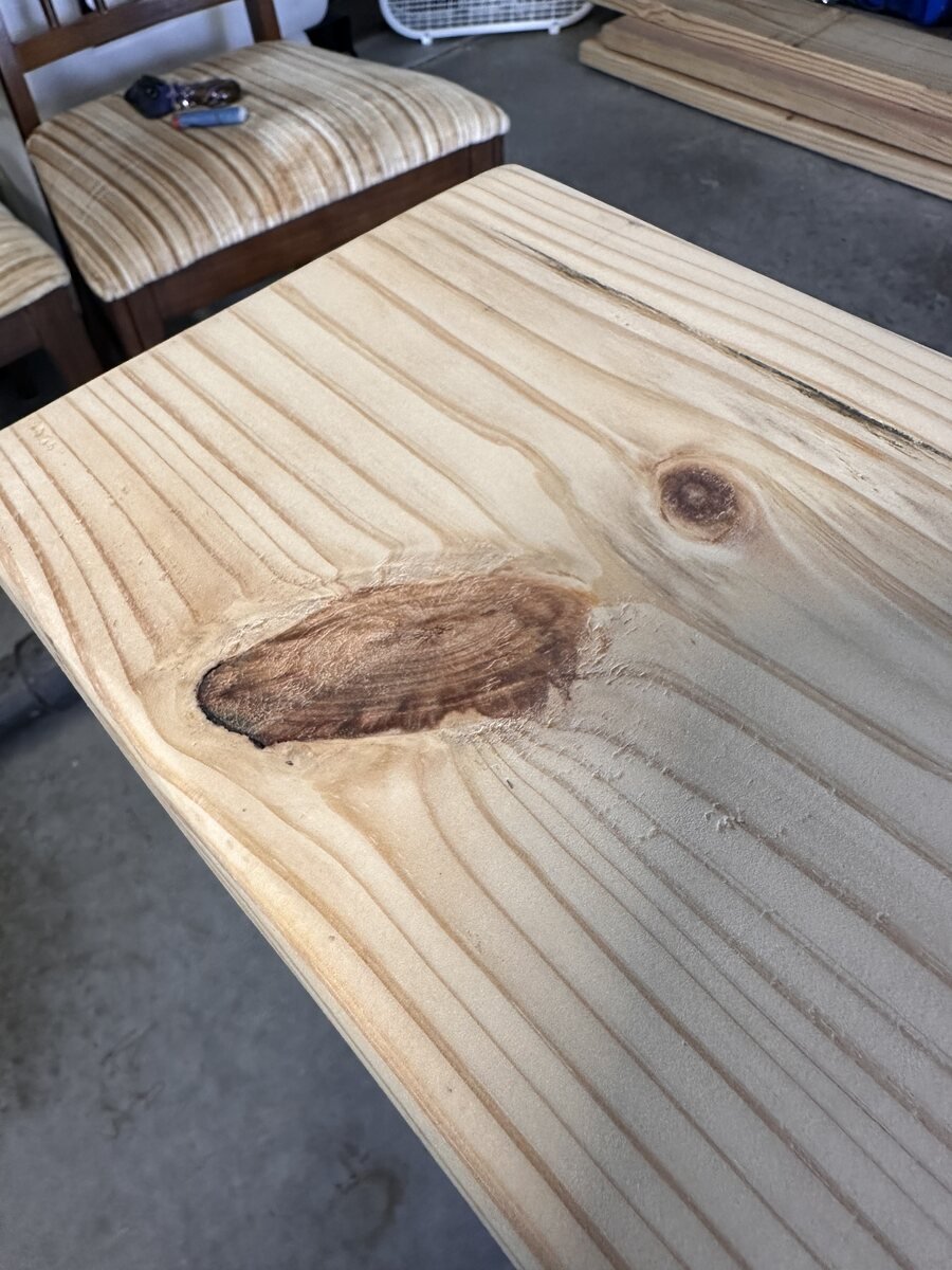 Elongated grain scar in the pine board