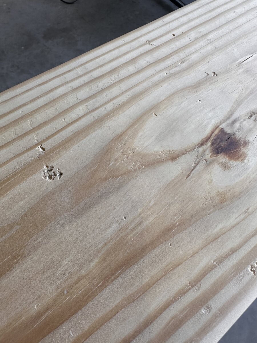 Faint old marks on the sanded board