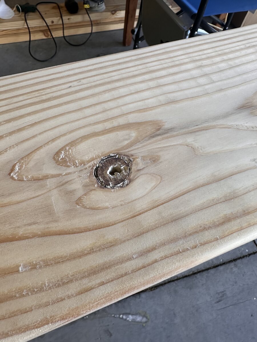 Smooth oval knot catching garage light