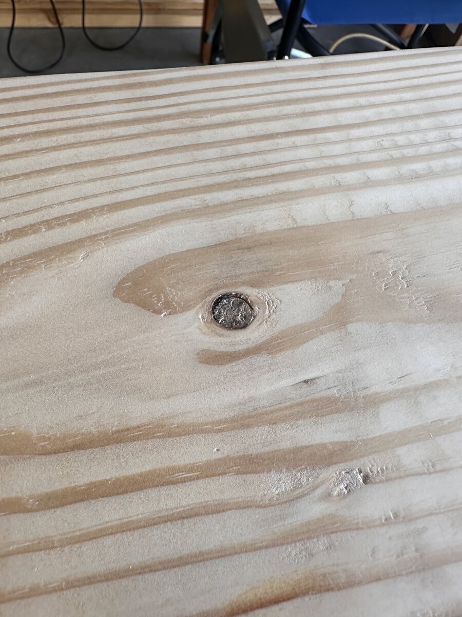Small knot framed by pine grain