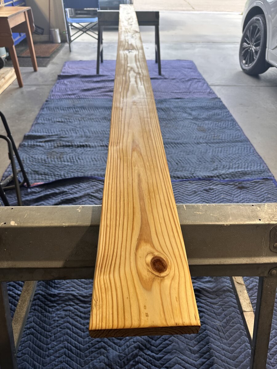 Long view of the freshly coated pine board