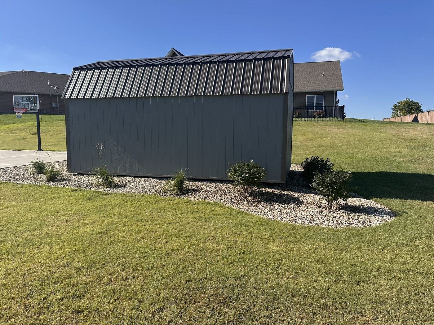 Opposite long-side view of the landscaped shed